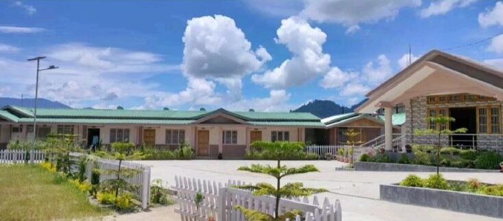 A beautiful view of the Ziro Valley with a traditional homestay.